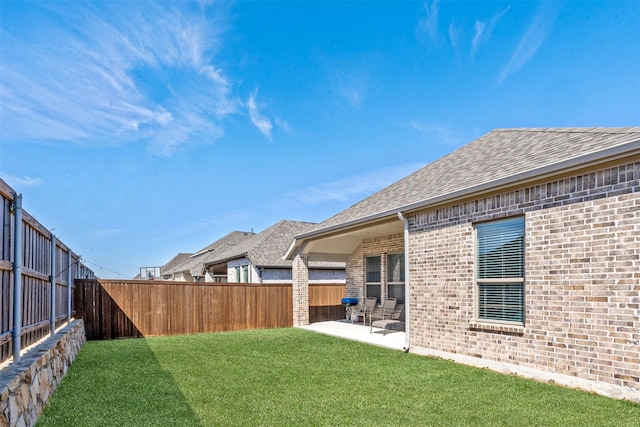 view of yard featuring a patio and a fenced backyard