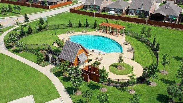 view of swimming pool featuring a residential view, fence, and a gazebo