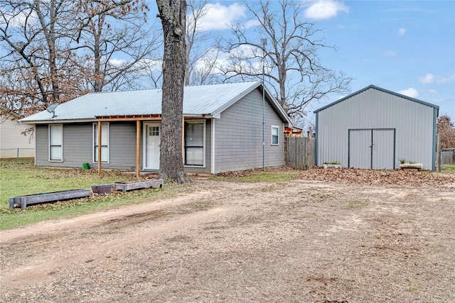 exterior space featuring fence and an outdoor structure