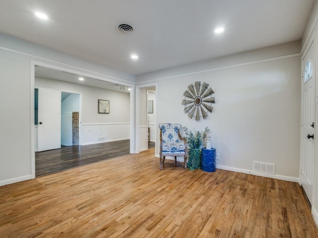 unfurnished room featuring light wood-style floors, recessed lighting, and visible vents