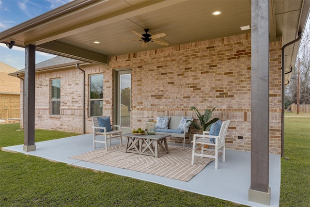 view of patio with ceiling fan and an outdoor living space