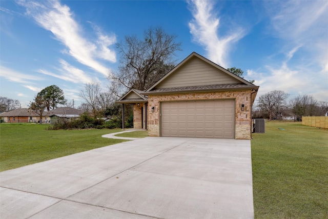 ranch-style house featuring an attached garage, stone siding, concrete driveway, and a front yard