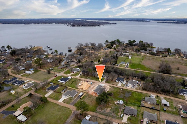 birds eye view of property with a residential view and a water view