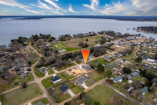 bird's eye view featuring a water view and a residential view