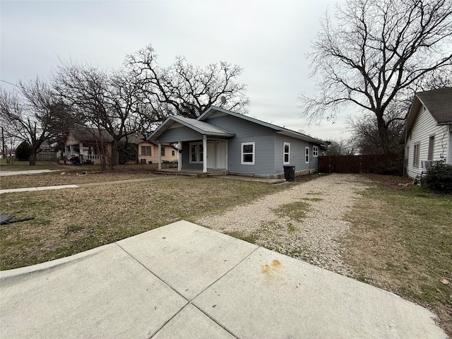 bungalow-style house with a front yard and driveway