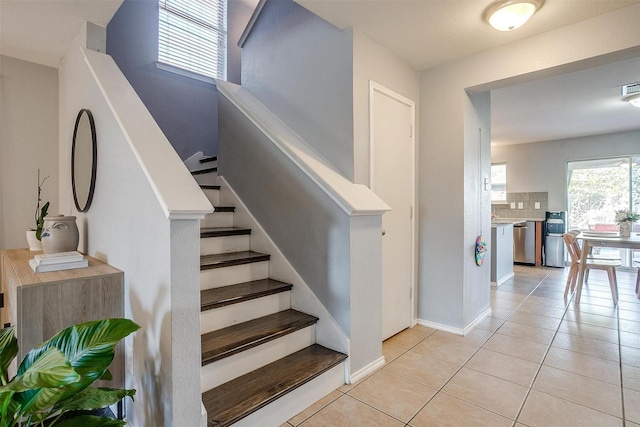 stairs featuring tile patterned floors