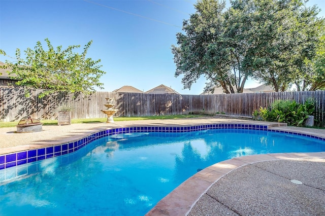 view of swimming pool with a fenced in pool and a fenced backyard