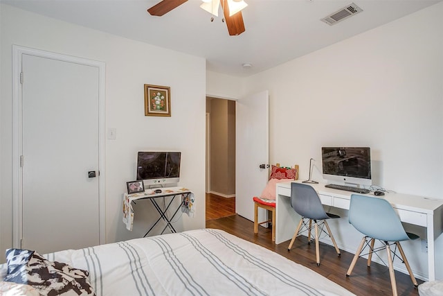 bedroom featuring visible vents, ceiling fan, and wood finished floors