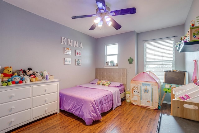 bedroom featuring ceiling fan and wood finished floors