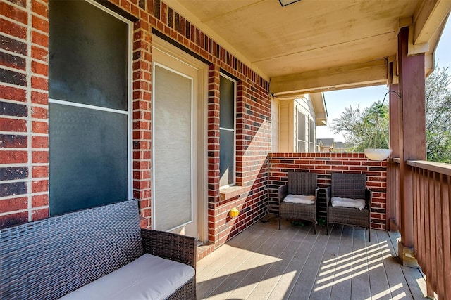 wooden terrace featuring a porch