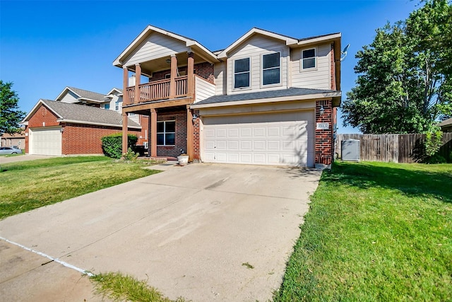 view of front of house with driveway, a front lawn, a balcony, fence, and brick siding