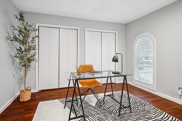 home office featuring dark wood-type flooring and baseboards