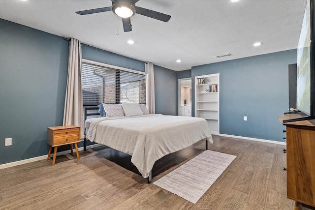 bedroom featuring recessed lighting, ceiling fan, baseboards, and wood finished floors