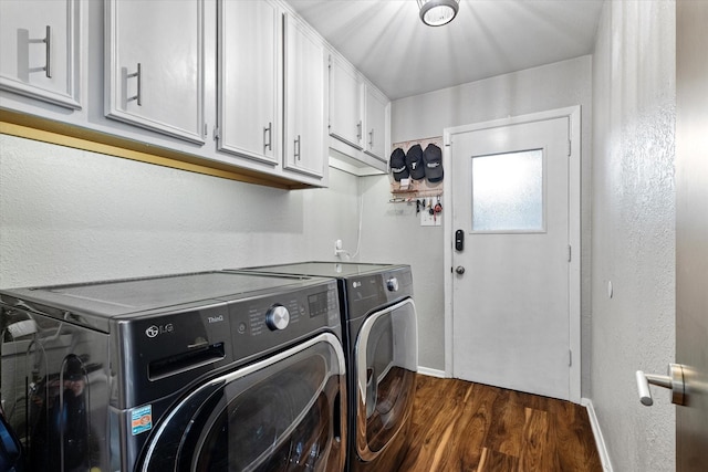 laundry room featuring independent washer and dryer, dark wood finished floors, cabinet space, and baseboards