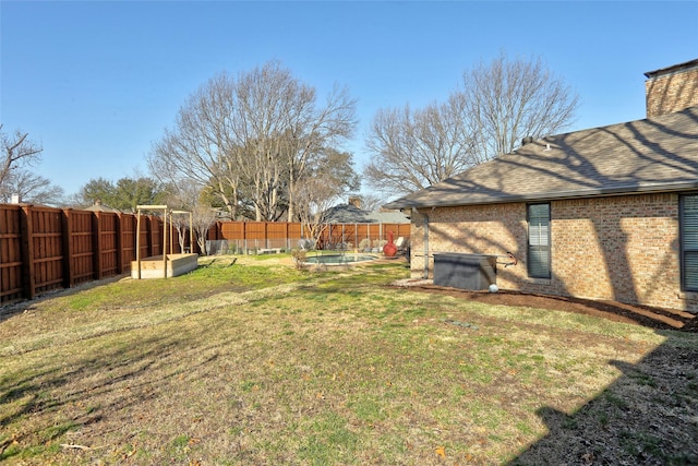 view of yard featuring a fenced backyard