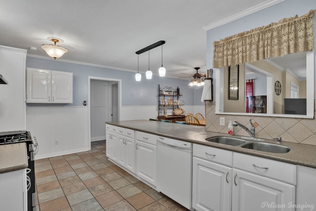 kitchen with stainless steel gas stove, dark countertops, white dishwasher, white cabinetry, and a sink