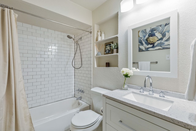 full bath featuring shower / bath combination with curtain, a textured wall, vanity, and toilet