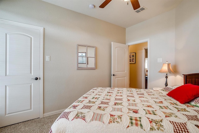 carpeted bedroom with visible vents and a ceiling fan