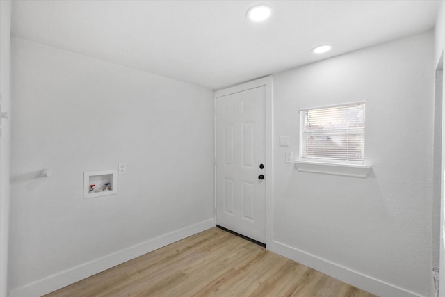 clothes washing area with laundry area, baseboards, light wood-style floors, washer hookup, and recessed lighting