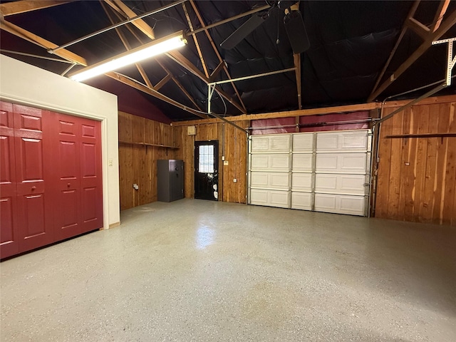 garage featuring wooden walls