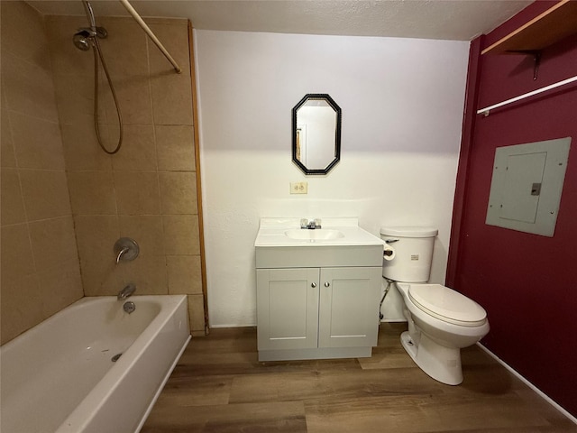 bathroom featuring toilet, shower / tub combination, electric panel, and wood finished floors