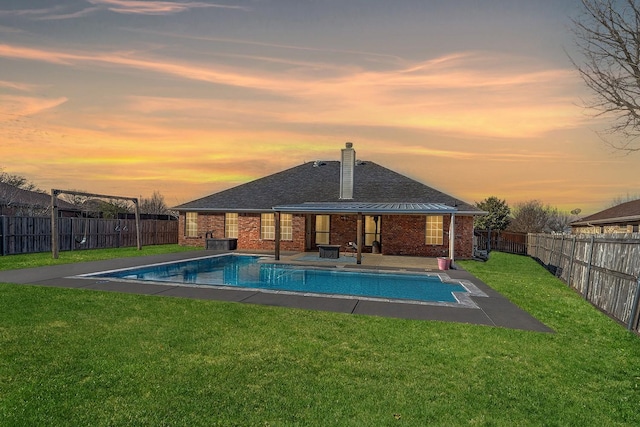 view of pool featuring a patio area, a fenced backyard, a fenced in pool, and a yard