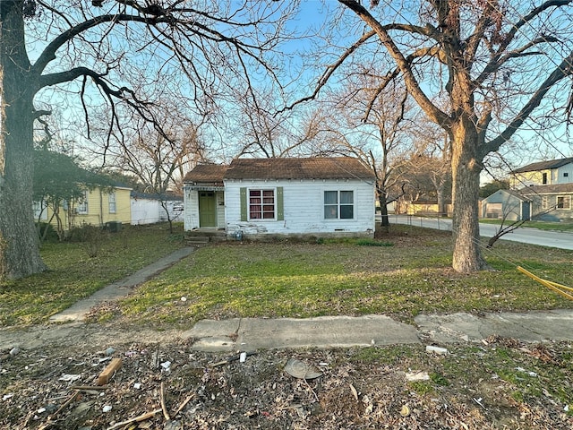 bungalow with a front yard