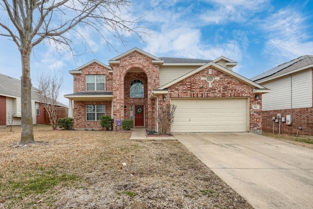 traditional home featuring a garage, concrete driveway, and brick siding