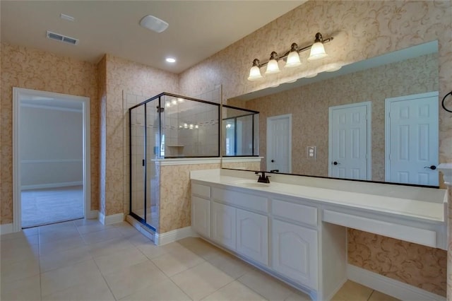 bathroom featuring tile patterned flooring, a shower stall, visible vents, and wallpapered walls