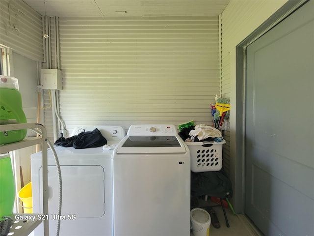 clothes washing area featuring independent washer and dryer and laundry area