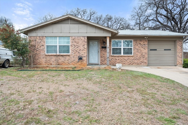 ranch-style home featuring a garage, concrete driveway, brick siding, and a front lawn