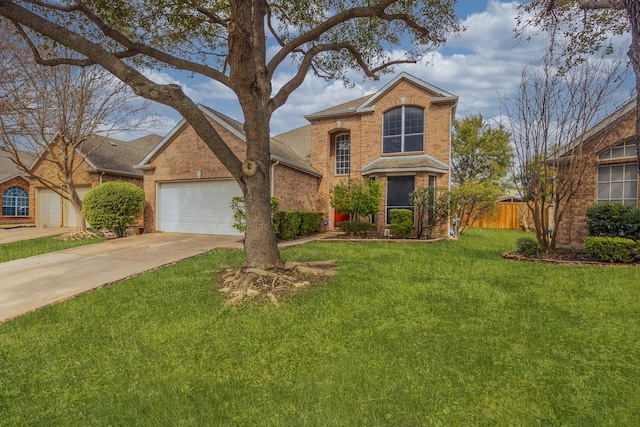 traditional-style house featuring a front lawn, fence, concrete driveway, a garage, and brick siding