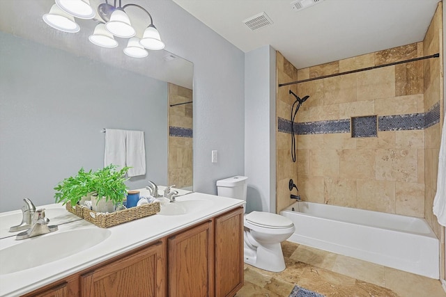 bathroom with toilet, a sink, visible vents, double vanity, and washtub / shower combination