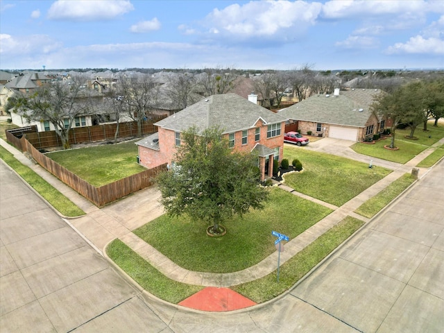 birds eye view of property with a residential view