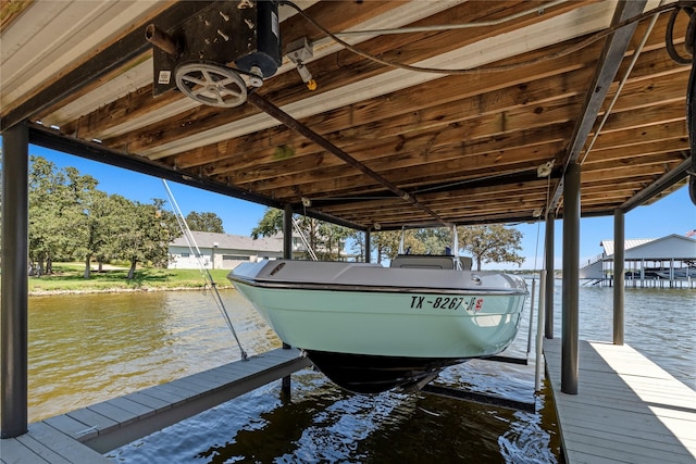 dock area featuring a water view and boat lift