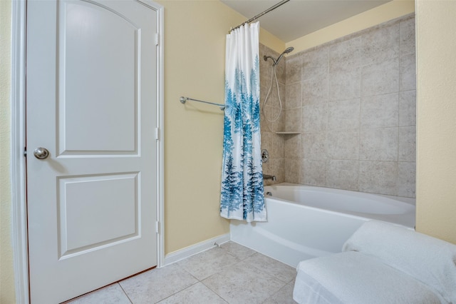 bathroom featuring baseboards, shower / bath combo, and tile patterned floors