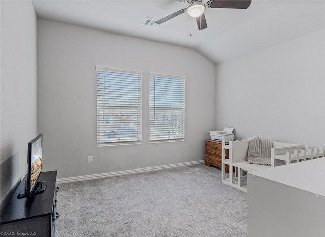 bedroom with lofted ceiling, ceiling fan, carpet floors, visible vents, and baseboards