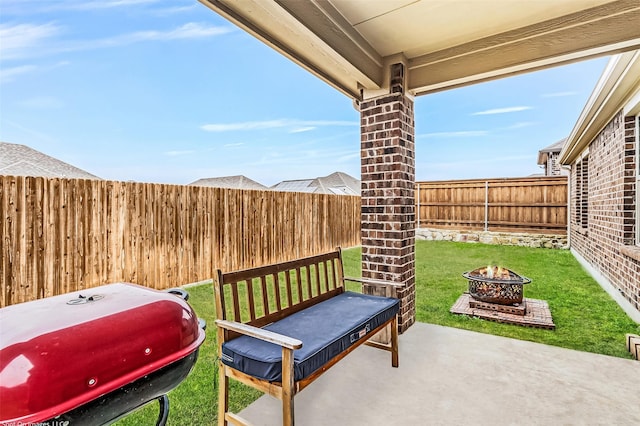 view of patio / terrace with an outdoor fire pit, a fenced backyard, and a grill