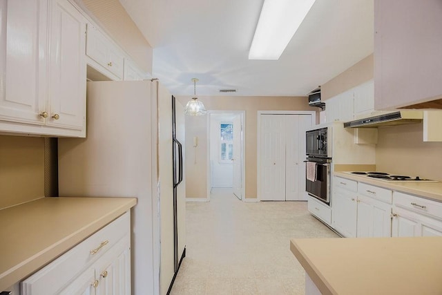 kitchen with white appliances, under cabinet range hood, visible vents, and white cabinets