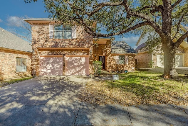 view of front of house with a garage, a front yard, brick siding, and driveway