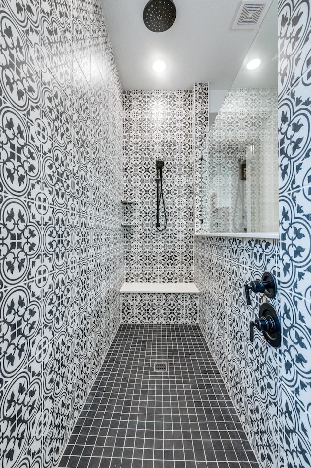 full bath with tile patterned flooring, visible vents, and a walk in shower