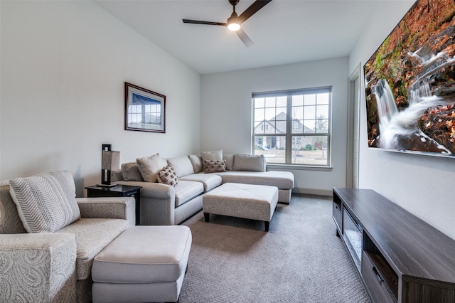 living area with ceiling fan and carpet flooring