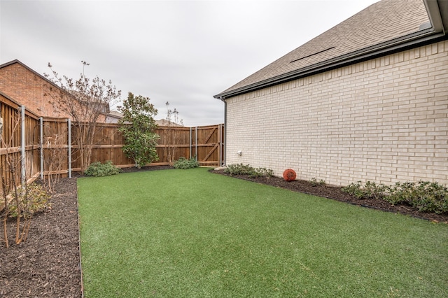 view of yard featuring a fenced backyard