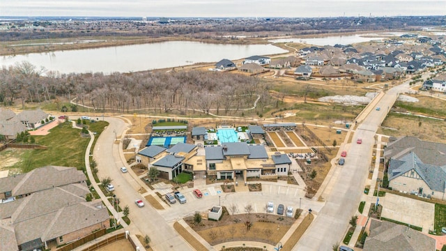 bird's eye view with a residential view and a water view