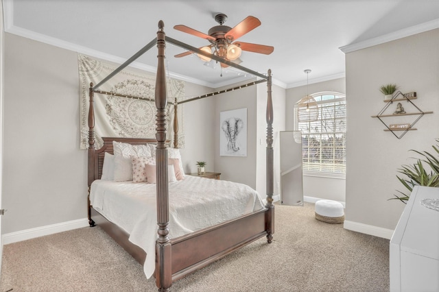 bedroom with a ceiling fan, carpet, baseboards, and crown molding