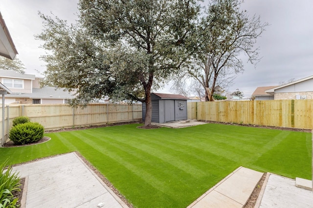 view of yard with an outbuilding, a fenced backyard, a patio, and a storage shed