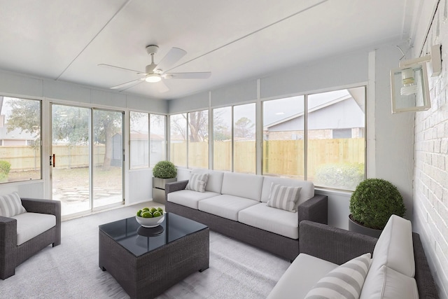 sunroom / solarium featuring ceiling fan