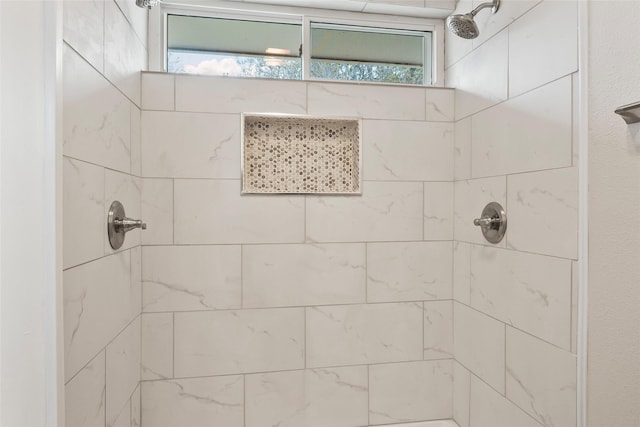 bathroom featuring tiled shower