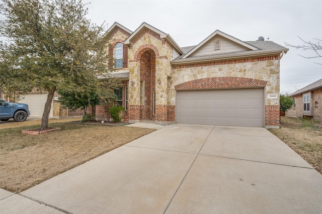 view of front of home with a garage, concrete driveway, brick siding, and roof with shingles