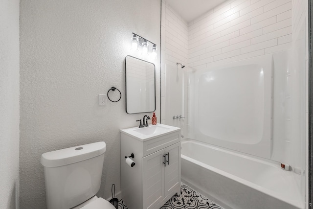 bathroom featuring toilet, a textured wall, tub / shower combination, and vanity